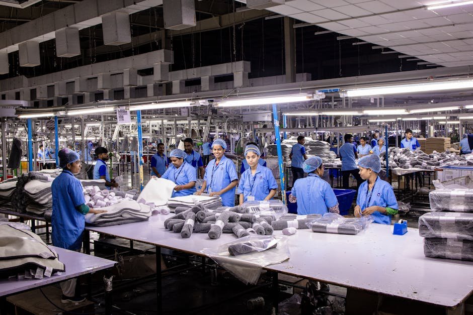 India’s Textile Sector Poised for Major Growth Amidst New Free Trade Agreements Indian textile factory workers expertly packaging products on an assembly line.