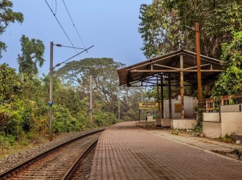 Rustic railway platform in Jhaluarber, West Bengal, India amidst lush greenery. Rustic railway platform in Jhaluarber, West Bengal, India amidst lush greenery.