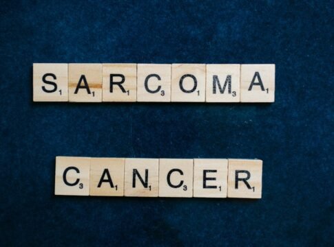 Sarcoma cancer awareness displayed using Scrabble tiles on a dark blue background. Sarcoma cancer awareness displayed using Scrabble tiles on a dark blue background.