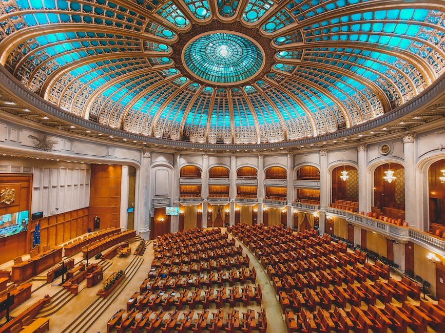 Union Public Service Commission Prelims 2026 Held Across India Under Strict Security Vibrant interior of a parliament hall with a grand dome and intricate architecture.