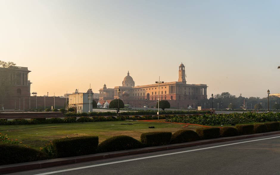 Delhi Draft Policy Proposes Bed and Breakfast Regulations with Room Limits, Categories, and Mandatory CCTV View of Rashtrapati Bhavan in New Delhi with manicured gardens and sunrise sky.