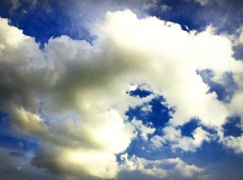 A beautiful cloudscape with cumulus clouds against a bright blue sky, capturing nature's tranquility. A beautiful cloudscape with cumulus clouds against a bright blue sky, capturing nature's tranquility.