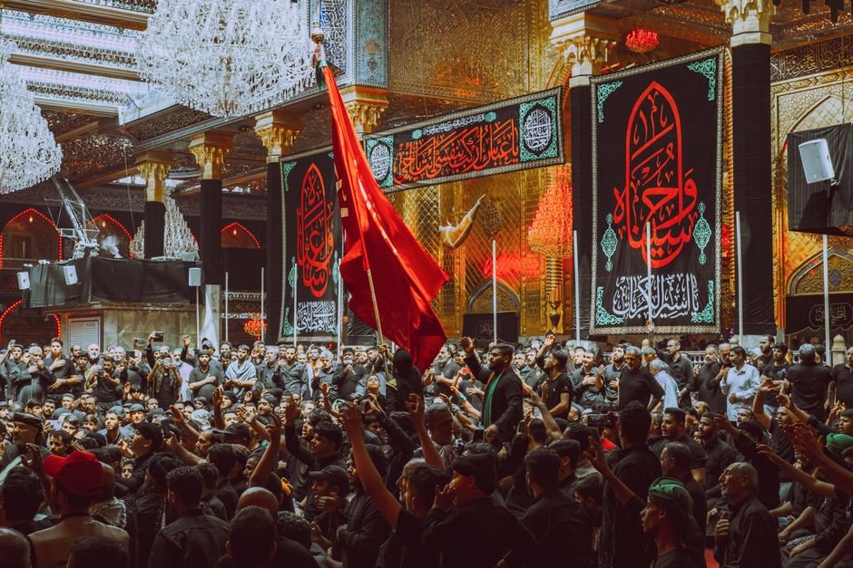 Srinagar Shia Leaders Urge Lifting of Restrictions on Ashura Procession A large crowd participates in a religious ceremony at a notable landmark in Karbala, Iraq.