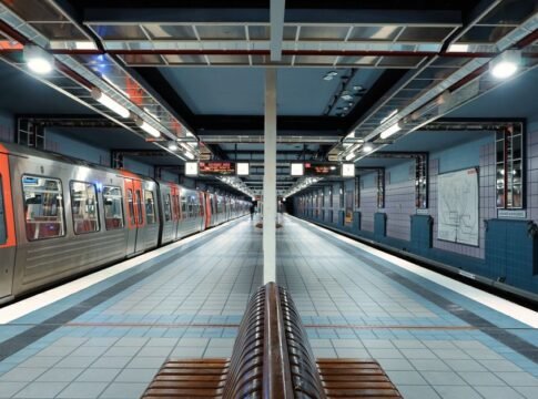 A quiet and modern subway station in Hamburg, showcasing sleek architecture and trains.