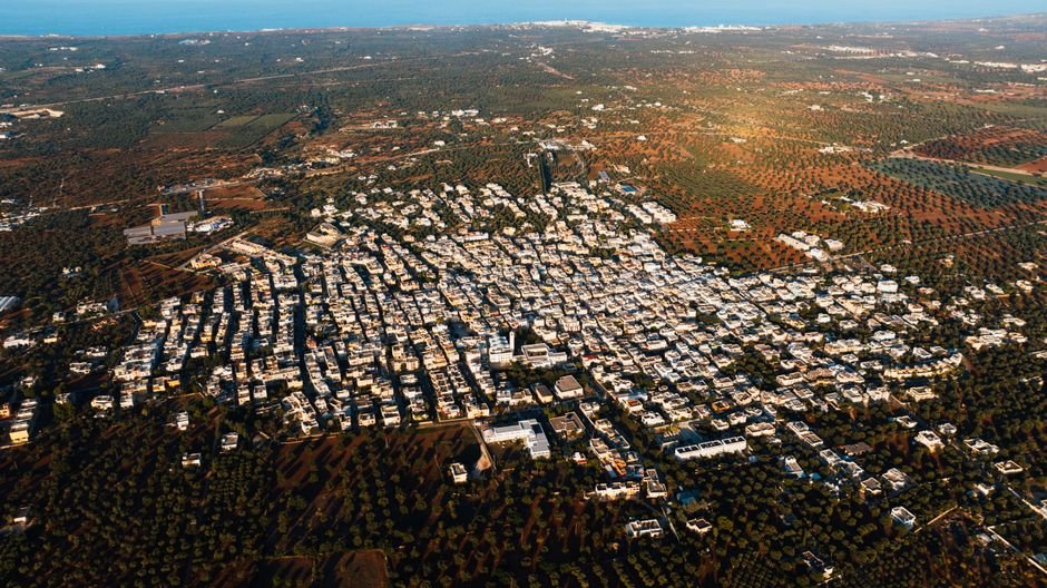 Haryana Minister Outlines ‘Magnet City’ Concept for NCR Growth, Rules Out RRTS Extension to Ambala A stunning aerial view of Fasano, Apulia, Italy, showcasing urban and rural landscapes.
