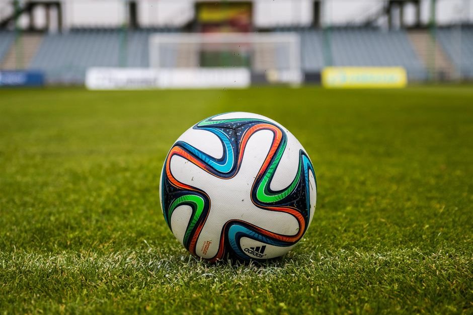 North America Kicks Off Historic FIFA World Cup Amidst Shared Hosting and Expanded Format A vibrant adidas soccer ball on a green field, perfect for sports enthusiasts.