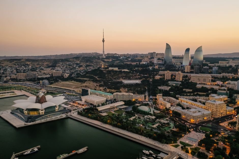 Maharashtra: Anna Hazare threatens hunger strike from July 5 over RTI rule changes Aerial view of Baku's skyline featuring the Flame Towers and Caspian Sea at dusk.