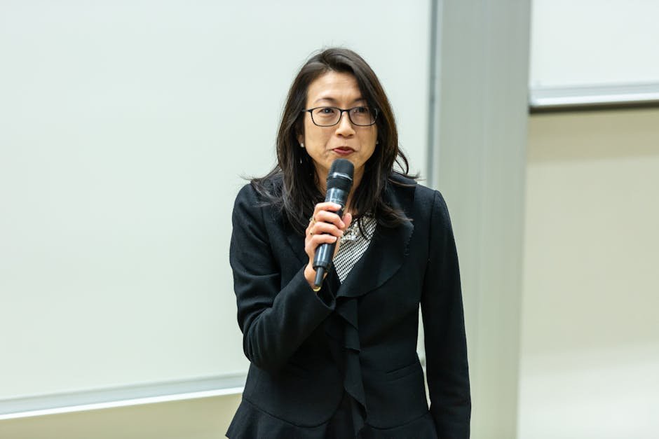 Peru Presidential Runoff Too Close to Call as Vote Count Continues Asian woman in a professional attire giving a talk in a conference room.