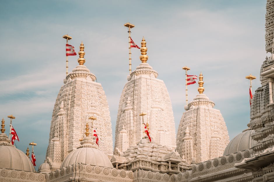 US Congressmen Back Resolution Condemning Hinduphobia, Praising Hindu-American Contributions Beautiful white stone spires of BAPS Shri Swaminarayan temple against a clear sky.