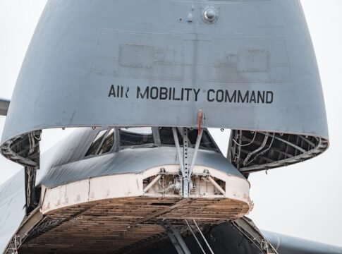 Close-up view of a military cargo aircraft with its bay open, displaying Air Mobility Command.