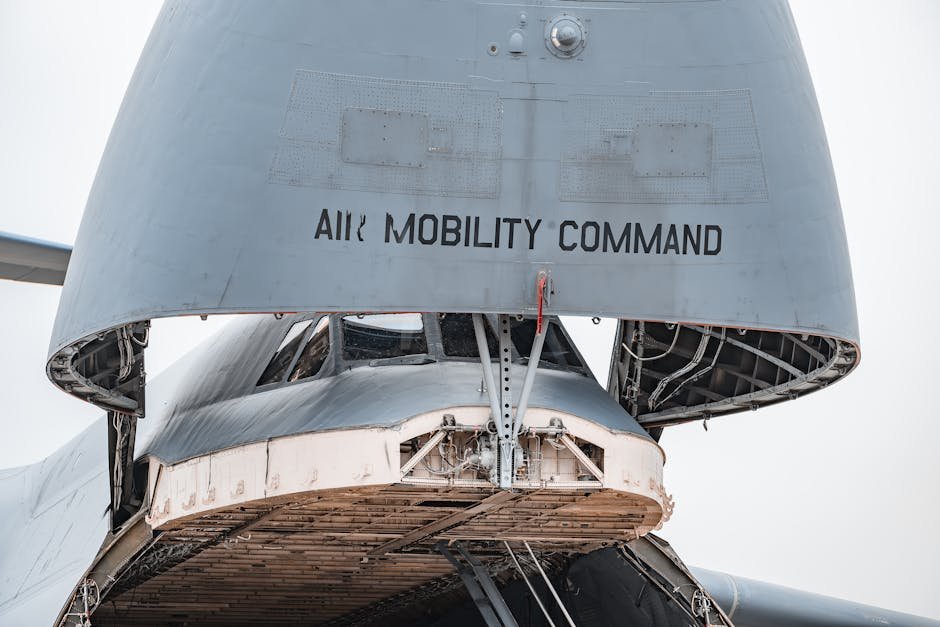 US Forces Shoot Down Iranian Drones, Strike Radar Sites Near Strait of Hormuz Close-up view of a military cargo aircraft with its bay open, displaying Air Mobility Command.