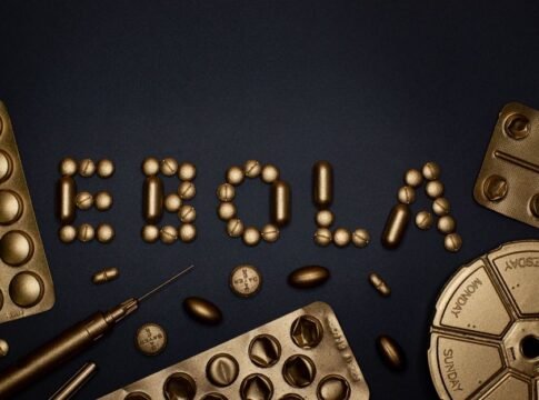 Creative arrangement of pills spelling 'EBOLA', showcasing a conceptual healthcare theme.