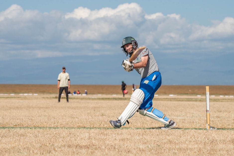 Kane Williamson Concludes Illustrious 16-Year International Cricket Career Cricketer hitting the ball during a match on a sunny day, showcasing athletic action and skill.