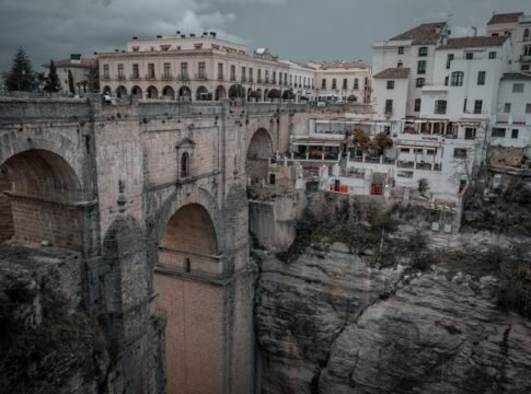 Dramatic view of Ronda's Puente Nuevo bridge over El Tajo gorge in Spain. Dramatic view of Ronda's Puente Nuevo bridge over El Tajo gorge in Spain.