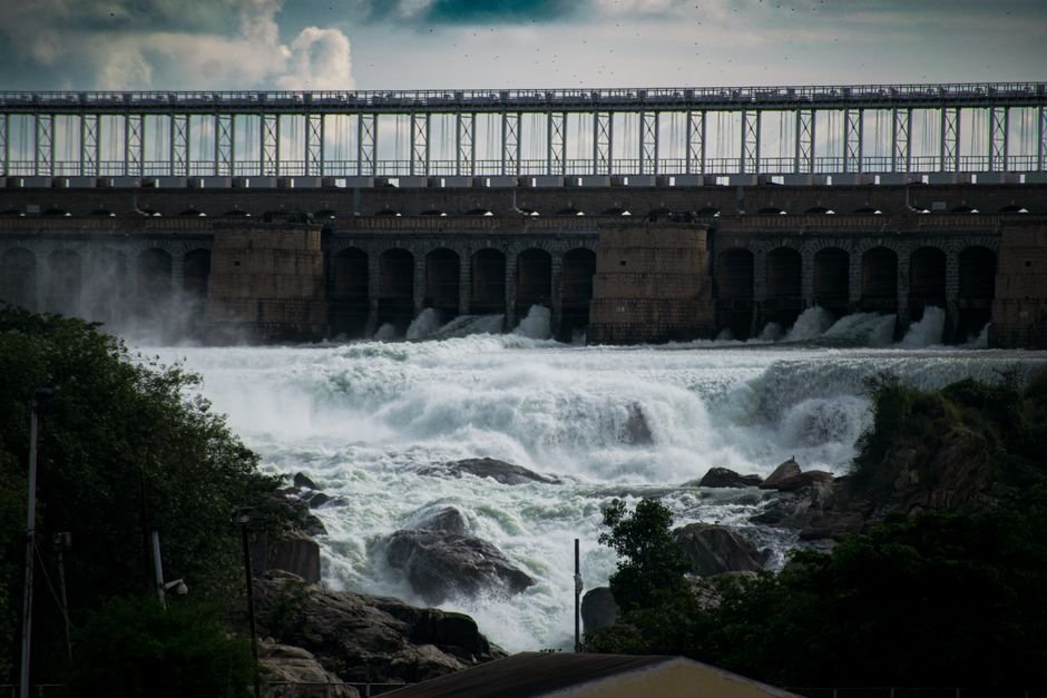 Andhra Pradesh: Prakasam Barrage Gates Opened to Release Surplus Water Dramatic view of a powerful waterfall cascading over a dam.