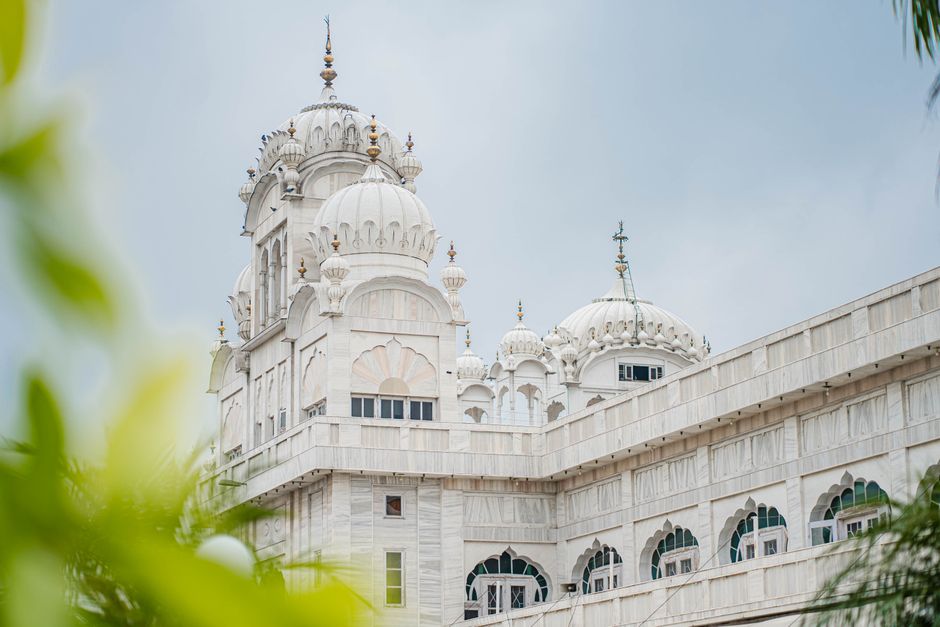Ludhiana: Health Department Stresses Community Awareness for Malaria Prevention Elegant white temple with domes and intricate architecture in Ludhiana, India.