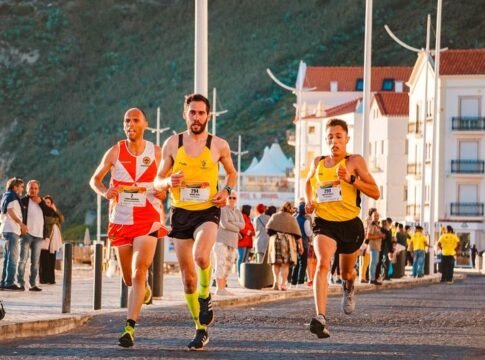 Exciting outdoor road race featuring male runners competing on a sunny day.