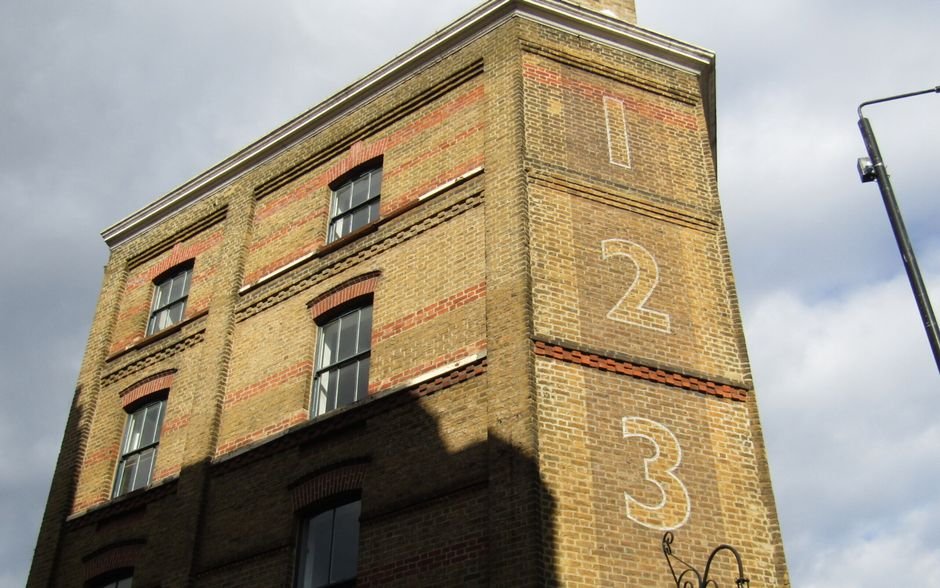 Delhi Government Orders Citywide Safety Crackdown on Coaching Centres Historic London building with numbered facade and classic architecture in sunlight.
