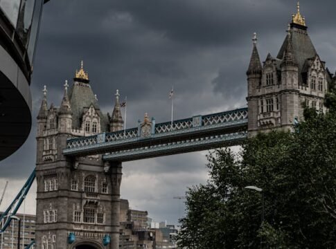 Scenic view of Tower Bridge in London, showcasing its majestic architecture under a dramatic sky. Scenic view of Tower Bridge in London, showcasing its majestic architecture under a dramatic sky.