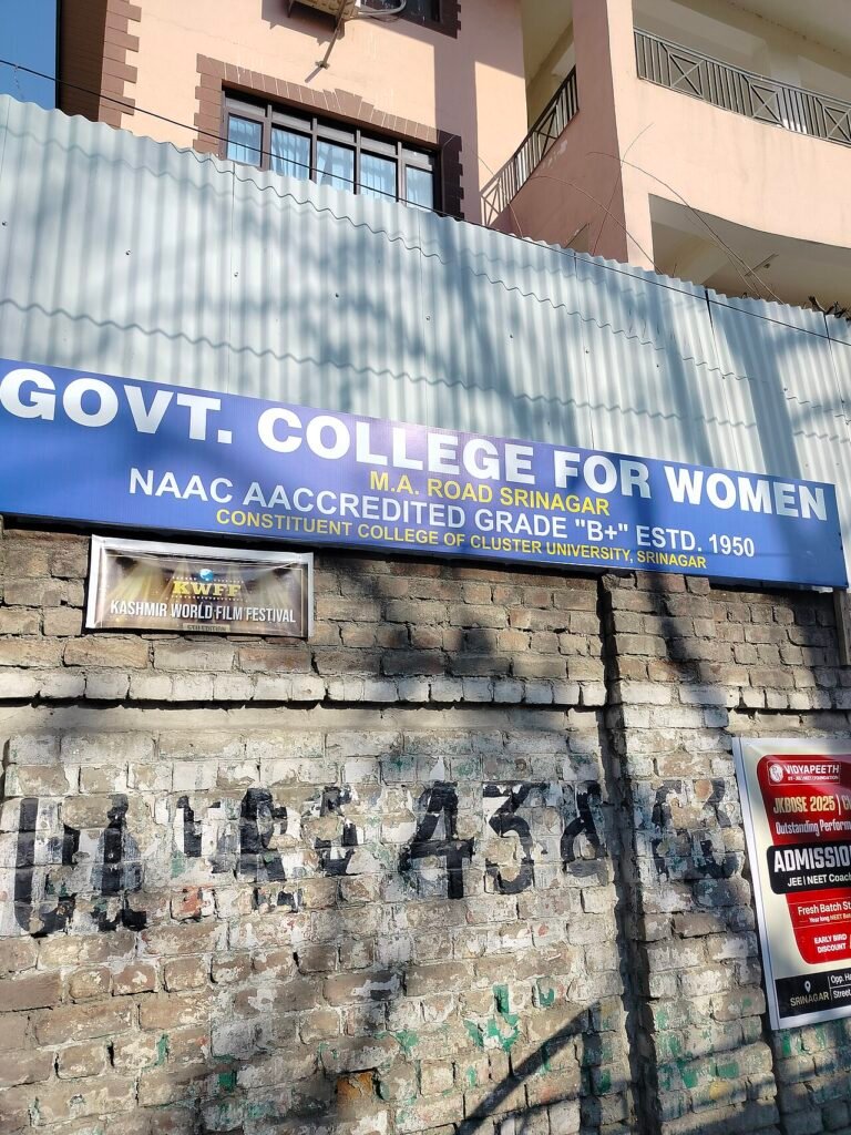 Signboard of Government College for Women, M.A. Road, Srinagar on its college wall.