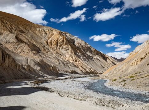 Stunning landscape of a flowing river amidst rugged mountains in Ladakh, India. Stunning landscape of a flowing river amidst rugged mountains in Ladakh, India.