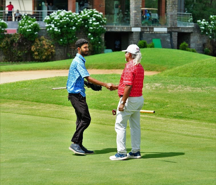 Jammu & Kashmir: Shubhankar Pathak Assigned Additional Charge of Red Cross General Secretary Two golfers shake hands on a lush green course in Hyderabad, India, celebrating their game.