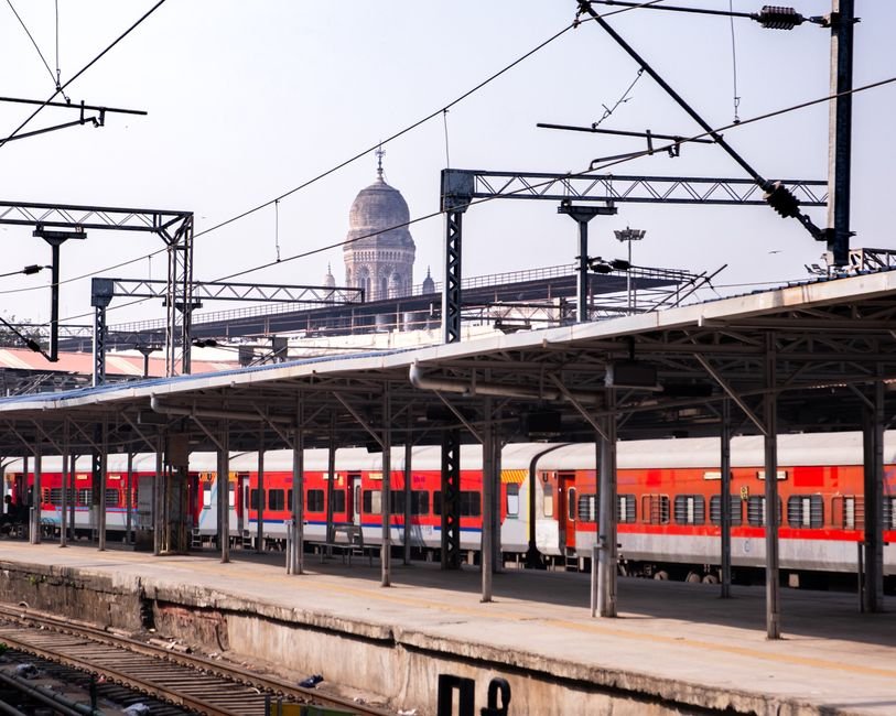 Pune Railway Station Upgrade Project Gets Underway with Foundation Stone Laying View of a train station in Mumbai with heritage architecture in the background, showcasing urban transport.
