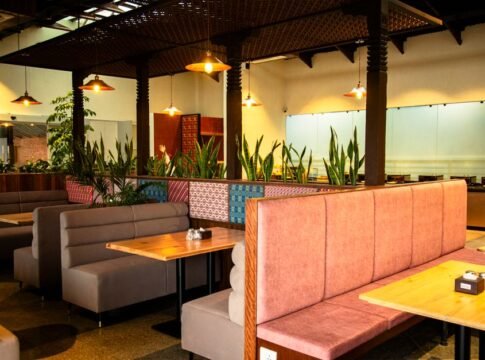 Warm, inviting restaurant interior showing empty booths and vibrant decor. Warm, inviting restaurant interior showing empty booths and vibrant decor.
