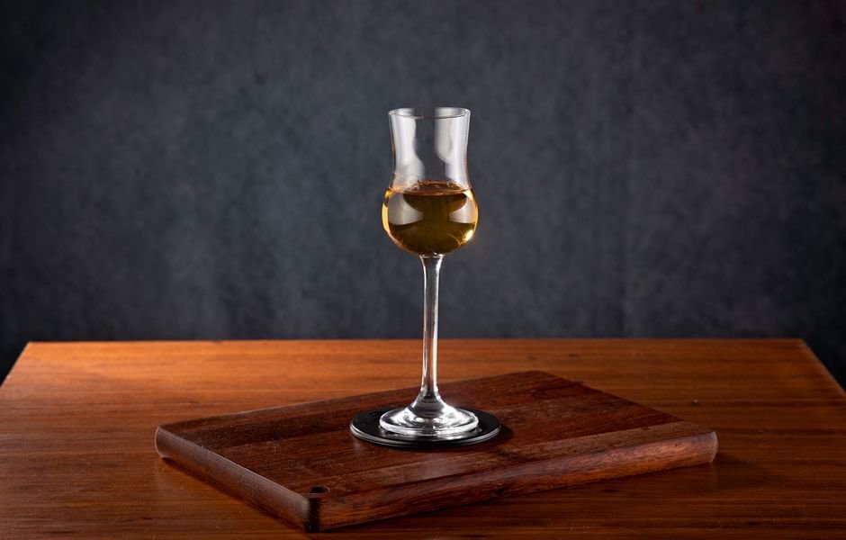 Jammu and Kashmir Politician Demands Resignations Over Ram Temple Donation Allegations A sophisticated tall glass of wine on a rustic wooden table, perfect for luxury dining settings.