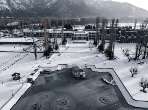 A stunning aerial view of a frozen Dal Lake with snow-covered scenery in Srinagar, Kashmir. A stunning aerial view of a frozen Dal Lake with snow-covered scenery in Srinagar, Kashmir.