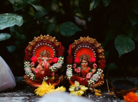 Colorful Ganesh and Lakshmi statuettes adorn a serene outdoor setting in Mumbai, India. Colorful Ganesh and Lakshmi statuettes adorn a serene outdoor setting in Mumbai, India.