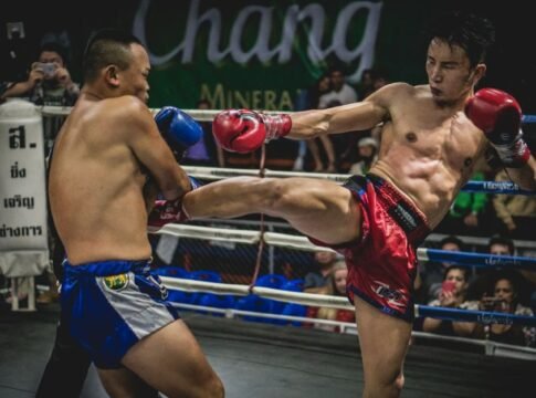 Dynamic moment in a Muay Thai match showcasing powerful kicks in a thrilling competition. Dynamic moment in a Muay Thai match showcasing powerful kicks in a thrilling competition.
