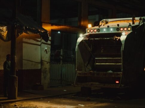 Garbage truck at night under city lights in Yurimaguas, Peru. Garbage truck at night under city lights in Yurimaguas, Peru.