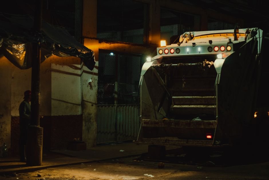 Garbage Truck Explosion Injures Sanitation Worker in Milwaukee Garbage truck at night under city lights in Yurimaguas, Peru.