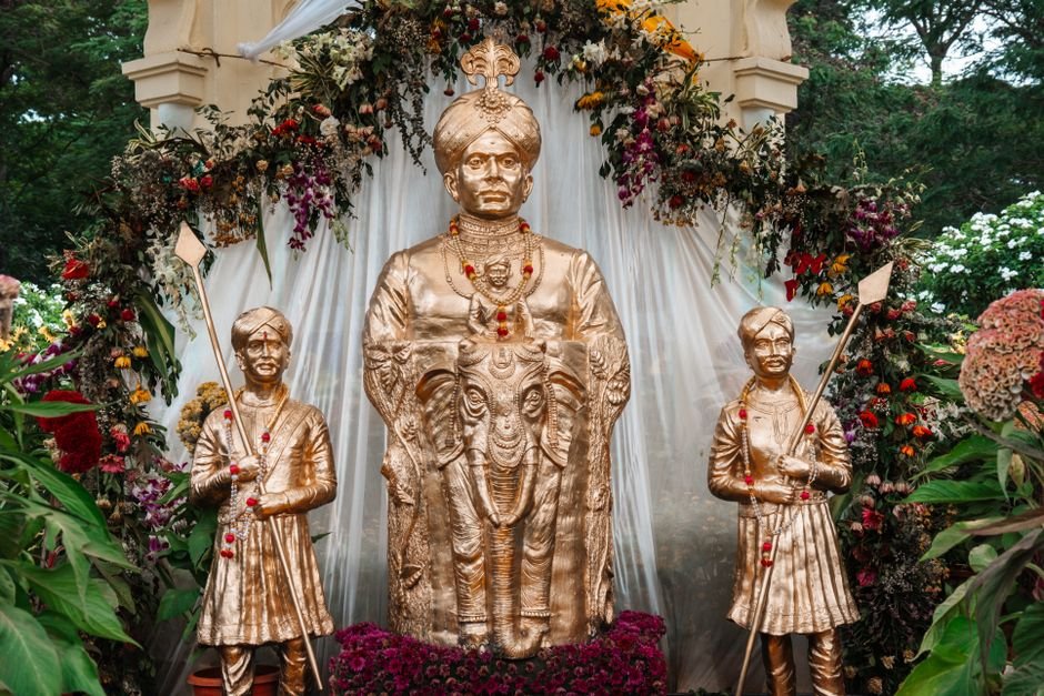 Mysuru Dasara Faces Opposition Over Proposed Kambala Inclusion Golden statues displayed with floral decorations during Mysore Dasara in Karnataka, India.