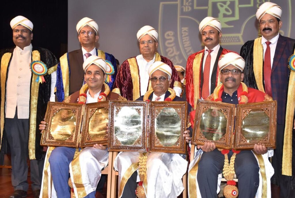 Governor Thaawarchand Gehlot conferring honorary doctorate on Anand Sankeshwar, A.V. S. Murthy and E.S. Chakravarthy, at the 17th convocation of KSOU in Mysuru