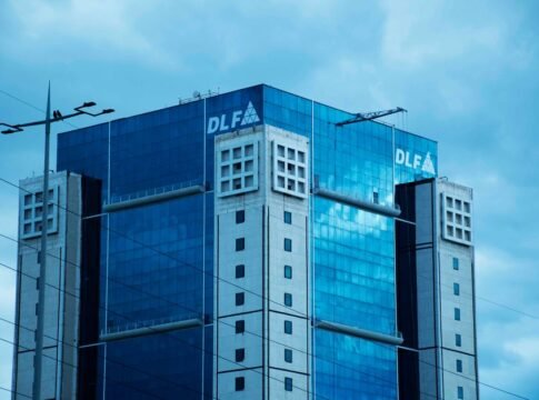High-rise commercial building DLF Square in Gurugram with glass facade under cloudy sky. High-rise commercial building DLF Square in Gurugram with glass facade under cloudy sky.