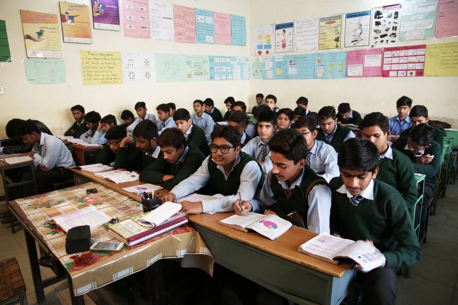 Himachal Pradesh Restores Independent Status of Nurpur Boys’ School, Revokes Merger High school boys attentively listening and taking notes in a crowded classroom.