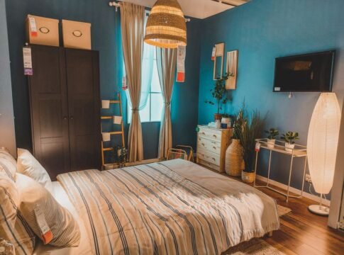 Inviting Scandinavian-style bedroom with natural light and cozy decor elements, perfect for relaxation.