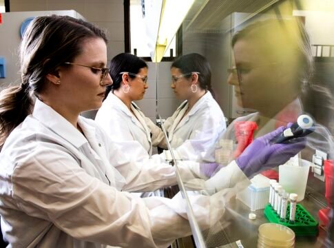 Jennifer Acuff, assistant professor of food safety, and M.S. student Erika Kadas collect Salmonella bacterial cells from agar plates to inoculate low-moisture foods, like milk powder, for thermal ina… Jennifer Acuff, assistant professor of food safety, and M.S. student Erika Kadas collect Salmonella bacterial cells from agar plates to inoculate low-moisture foods, like milk powder, for thermal ina…
