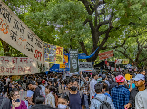 Students gather in New Delhi for a peaceful protest, displaying banners and signs at Jantar Mantar.