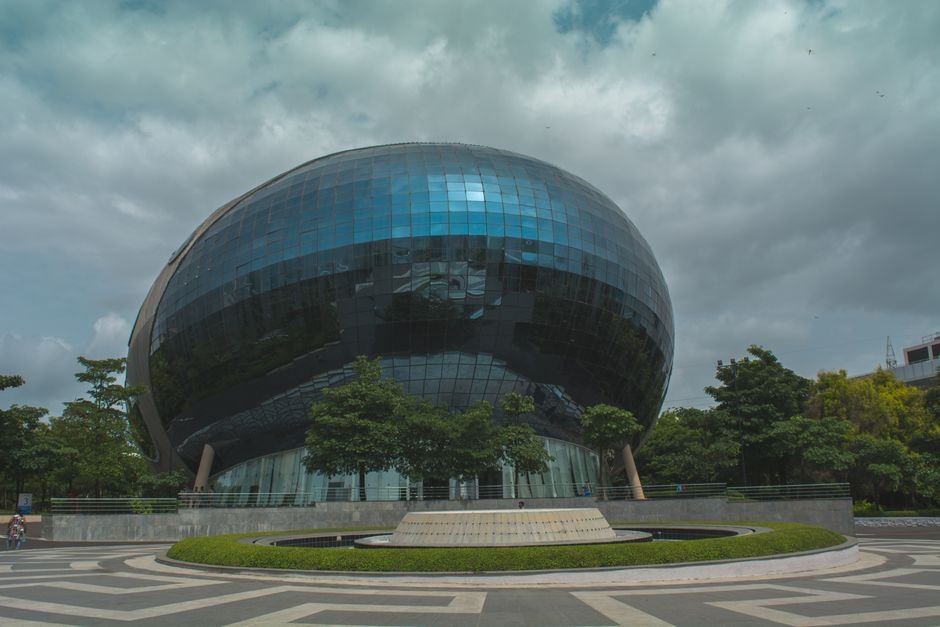 Stunning modern architecture in Pimpri-Chinchwad, Maharashtra, India featuring reflective glass facade.