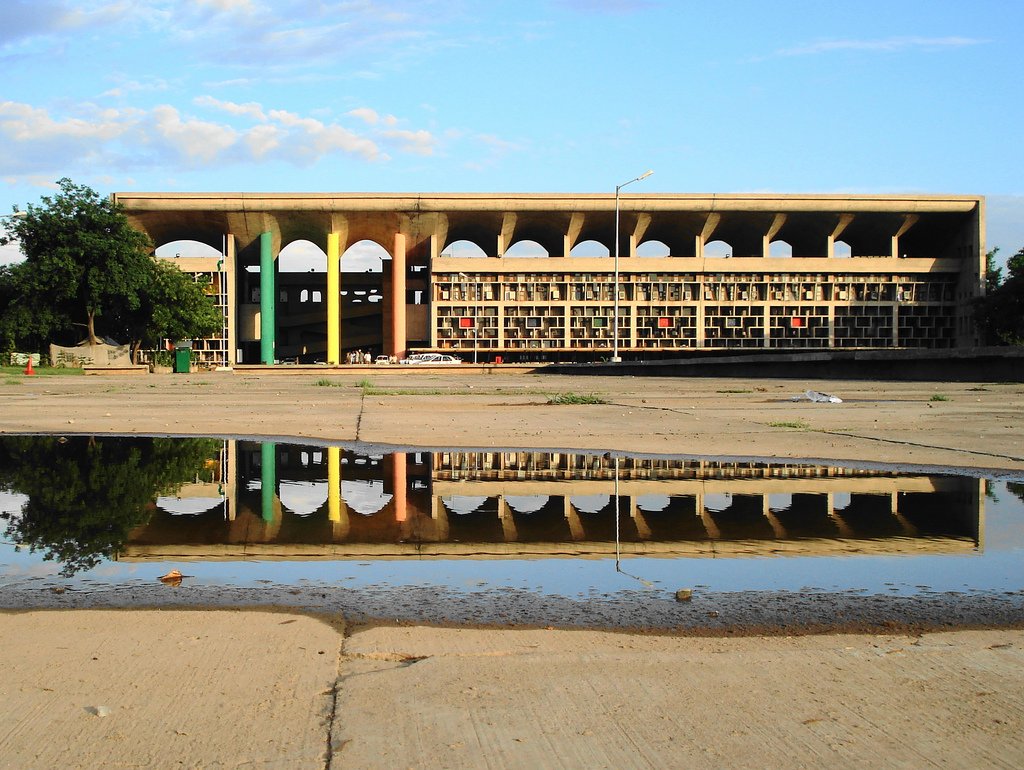 Ludhiana Civil Case: High Court Orders Inquiry into Missing Court File Document This photograph was selected for an exhibition at the High Court, Chandigarh. The linear block with main facade towards Piazza. The rhythmic arcade of parasol like roof, which shades the building in …