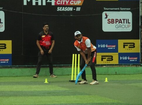 Two cricket players on a turf field during the MH14 City Cup Season III match.