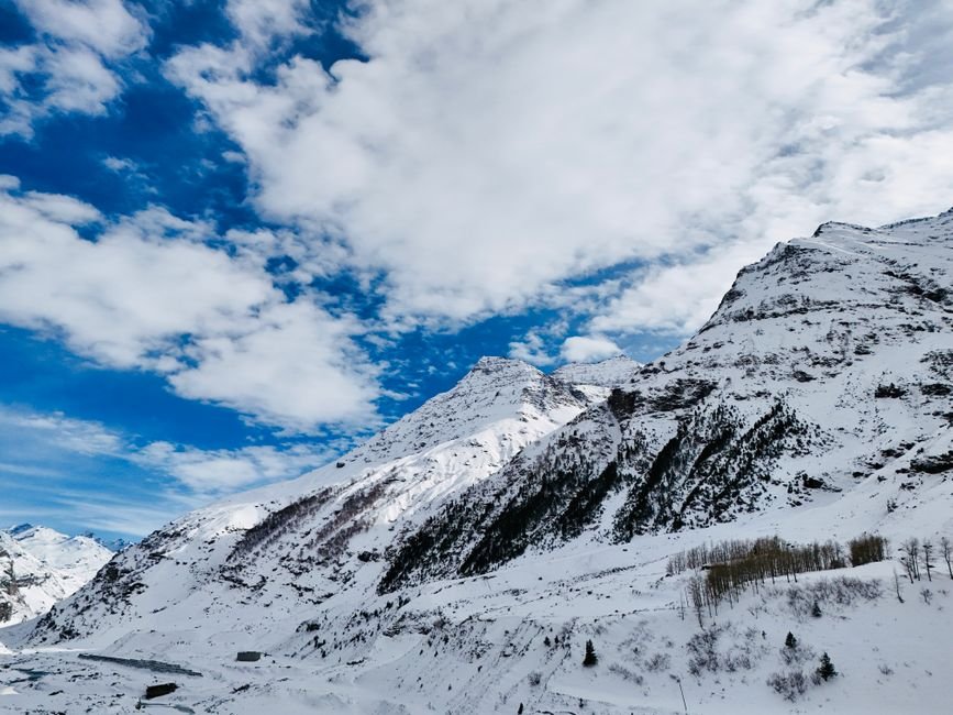 Himachal Pradesh: Schools Closed in Kullu Amid Heavy Rainfall; Orange Alert Issued A breathtaking aerial shot of the snow-covered Himalayan mountains in Himachal Pradesh, India.