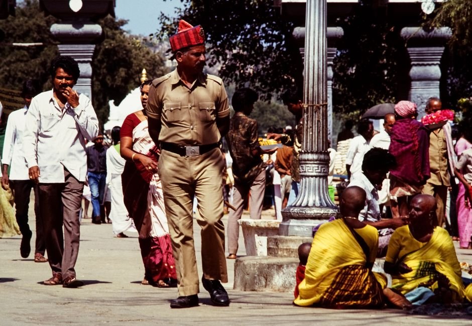 Andhra Pradesh’s Growth Rate Surpasses Telangana’s at 11.3%, Says Chief Minister Chandrababu Naidu A bustling street scene in India featuring a diverse crowd and a policeman walking amidst people.