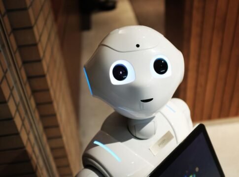 A futuristic humanoid robot in an indoor Tokyo setting, showcasing modern technology. A futuristic humanoid robot in an indoor Tokyo setting, showcasing modern technology.