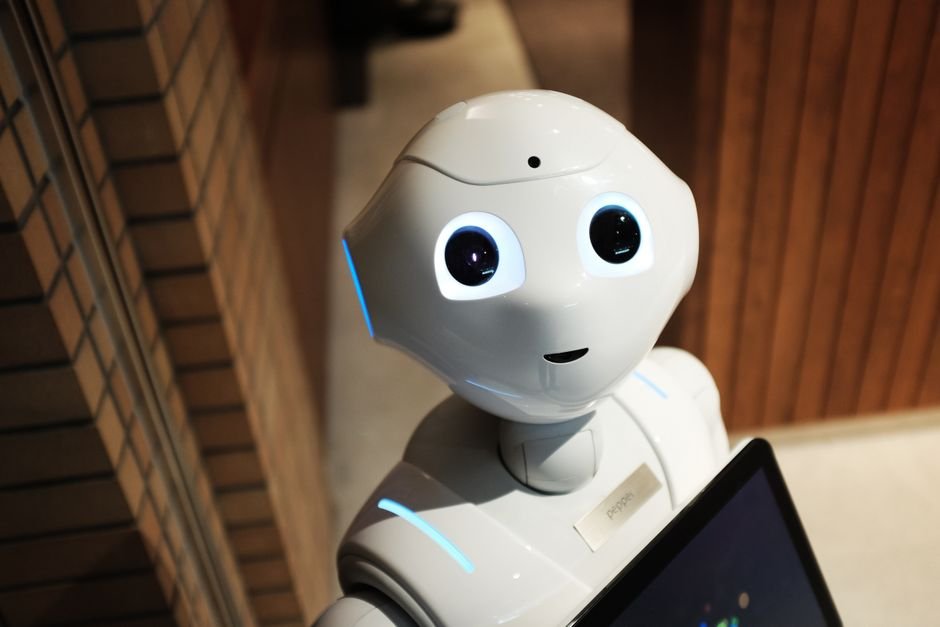 AI Poised to Revolutionize Multi-Hazard Early Warning Systems, Report Finds A futuristic humanoid robot in an indoor Tokyo setting, showcasing modern technology.