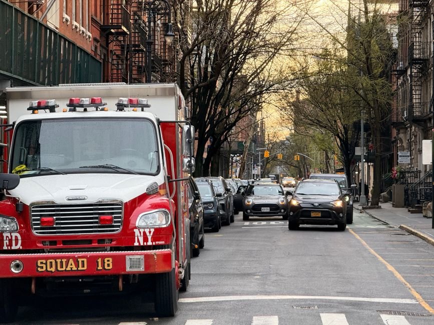 Injuries Reported in Astor Place Subway Track Fire A red fire truck from FDNY Squad 18 on a tree-lined street in New York City.