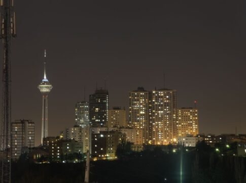A stunning night view of Tehran's skyline with the iconic Milad Tower prominently visible. A stunning night view of Tehran's skyline with the iconic Milad Tower prominently visible.